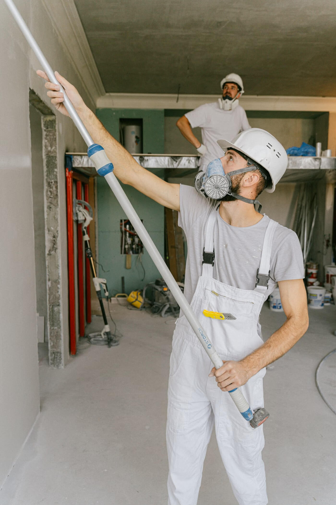 Construction workers completing an active interior renovation project