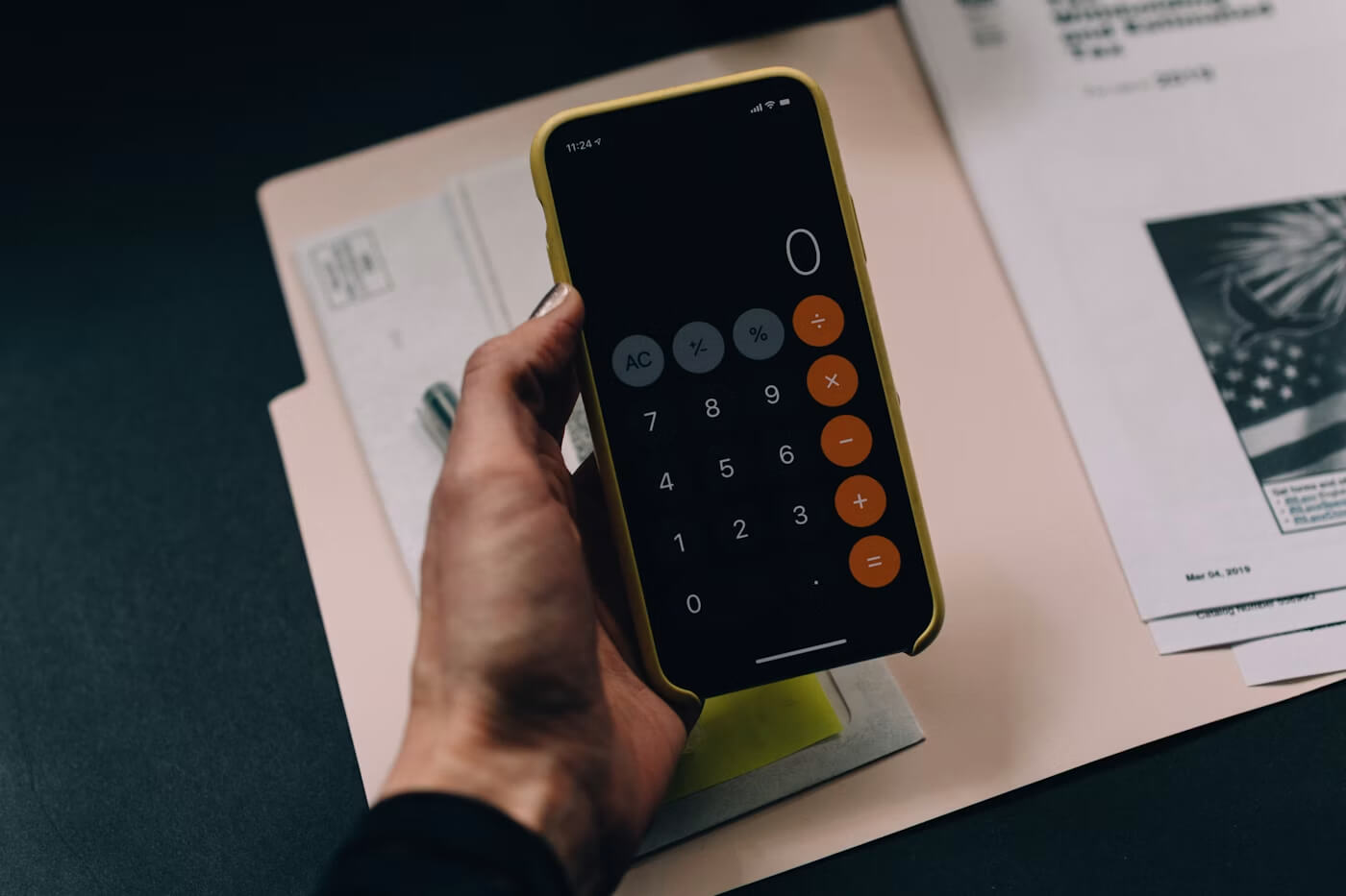 Calculator, documents, and cost planning materials used for project estimating
